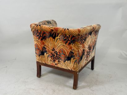 Molded wood armchair with floral velvet upholstery.
70...