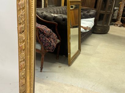 Large wood and gilded stucco mirror with...