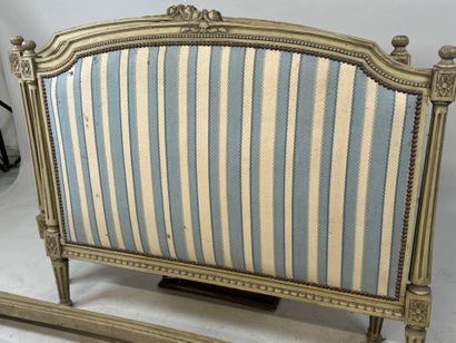 Lacquered, molded and carved wooden bed decorated...