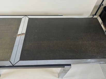 Extendable table in stained wood and chrome.
70s.
73...