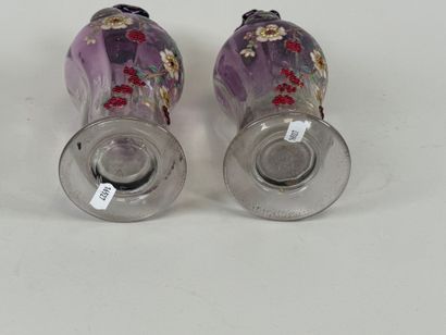 Pair of vases in partially colored and enameled...