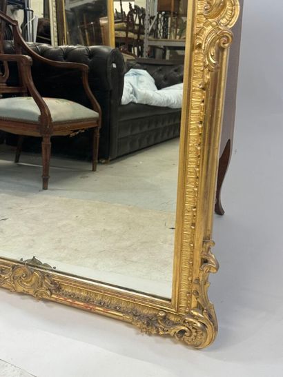 Large gilded and carved wood mirror with...