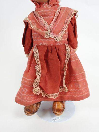 Fabric doll with boiled cardboard head.
Cloth...
