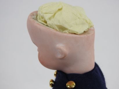 Little doll with bisque head, fixed eyes,...