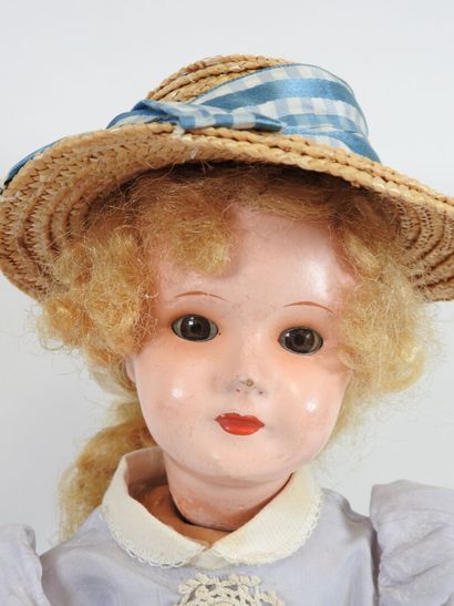 Doll with boiled cardboard head, fixed eyes,...