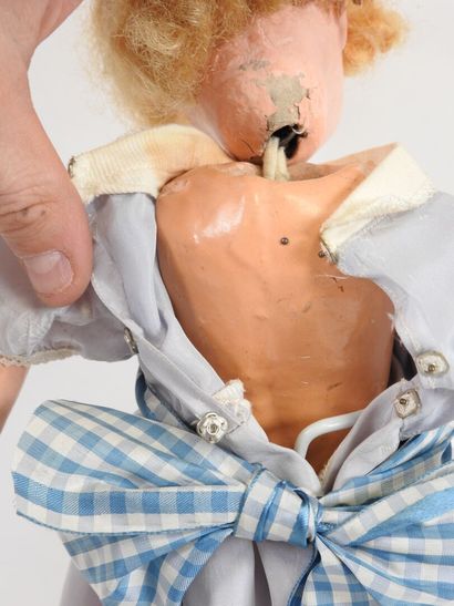 Doll with boiled cardboard head, fixed eyes,...