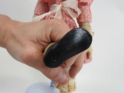 LIMMER.
Boiled cardboard doll with painted...