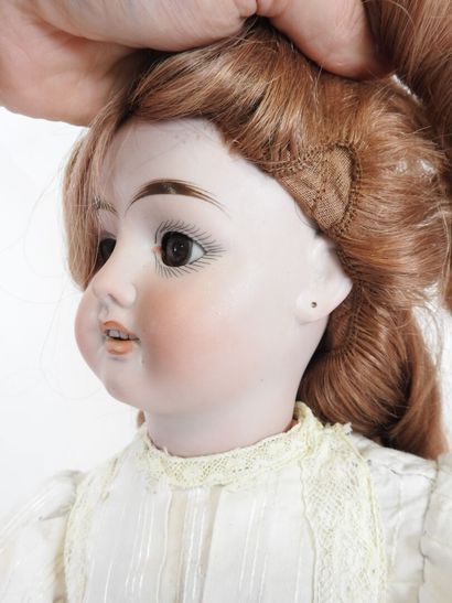 Bisque head doll, fixed eyes, open mouth...