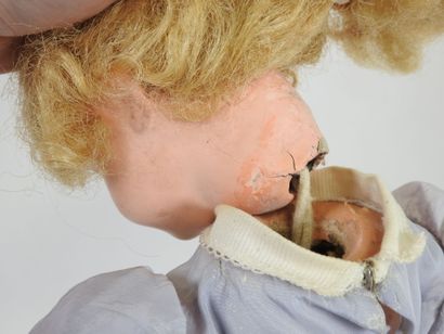 Doll with boiled cardboard head, fixed eyes,...