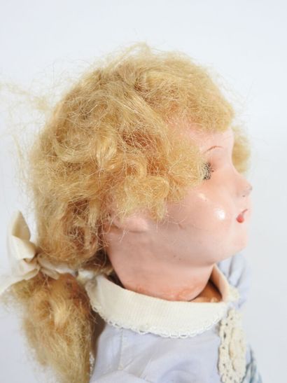 Doll with boiled cardboard head, fixed eyes,...