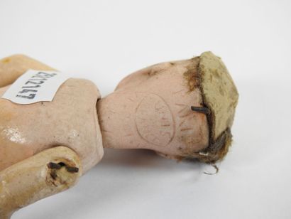 UNIS FRANCE.
Little doll with bisque head,...