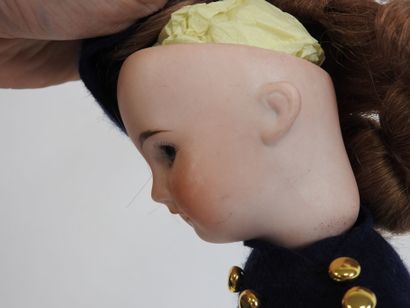 Little doll with bisque head, fixed eyes,...