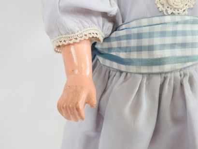 Doll with boiled cardboard head, fixed eyes,...