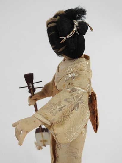 Automaton and musical doll featuring a Japanese...