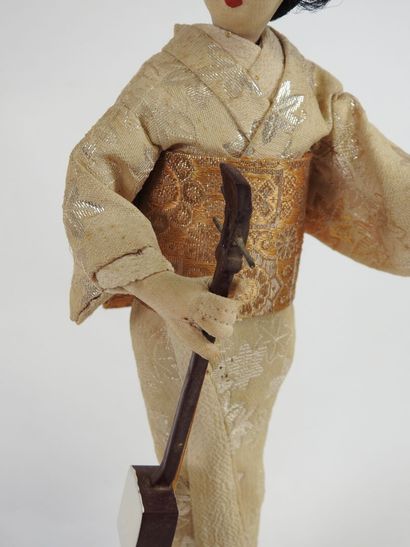 Automaton and musical doll featuring a Japanese...