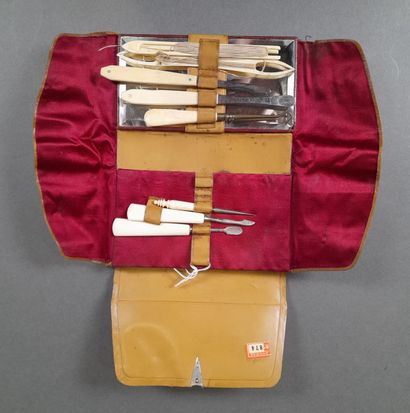 Epi embossed brown leather travel set, red...