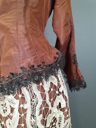 Brown fluted silk ensemble including a bodice...