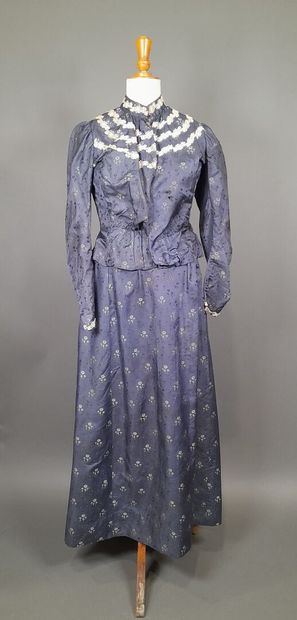 Set in shaped silk decorated with blue and...