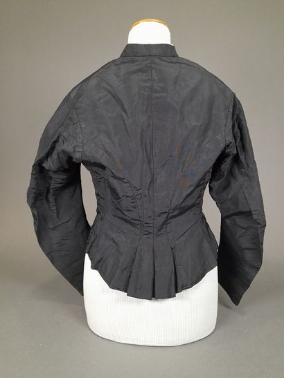 Set of two black fluted silk whalebone bodices,...