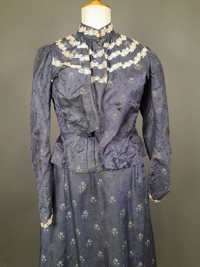 Set in shaped silk decorated with blue and...