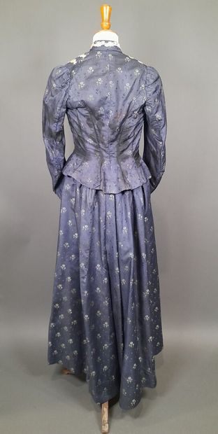 Set in shaped silk decorated with blue and...
