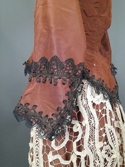 Brown fluted silk ensemble including a bodice...