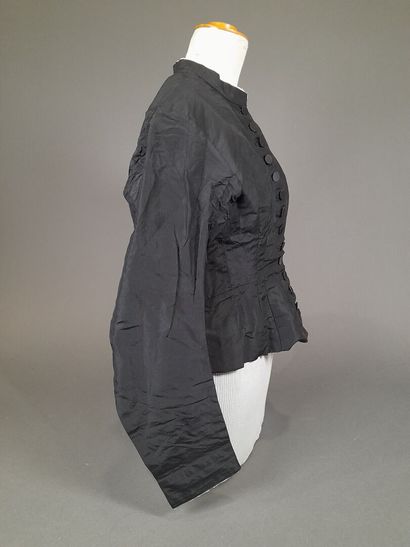 Set of two black fluted silk whalebone bodices,...