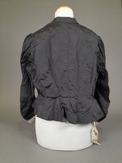 Set of two black fluted silk whalebone bodices,...