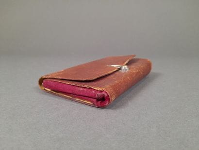 Epi embossed brown leather travel set, red...