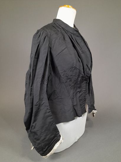Set of two black fluted silk whalebone bodices,...
