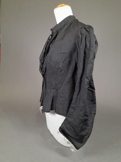 Set of two black fluted silk whalebone bodices,...