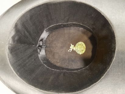 Black satin hat adorned with matching grosgrain...