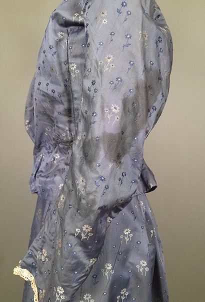 Set in shaped silk decorated with blue and...