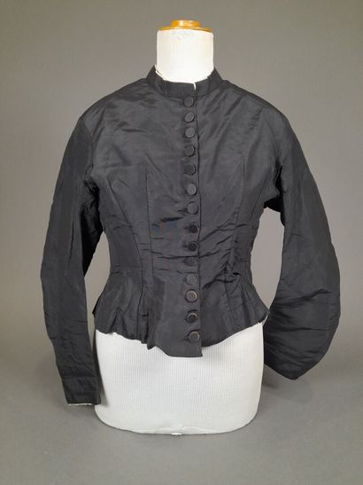 Set of two black fluted silk whalebone bodices,...