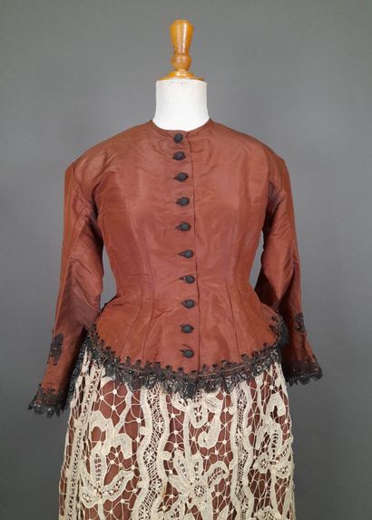 Brown fluted silk ensemble including a bodice...