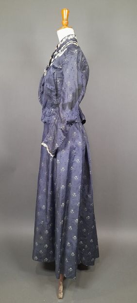 Set in shaped silk decorated with blue and...