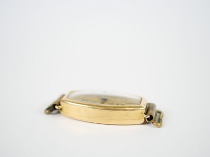 18K yellow gold tonneau-shaped lady's wristwatch...