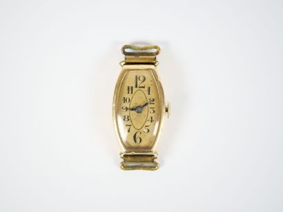 18K yellow gold tonneau-shaped lady's wristwatch...