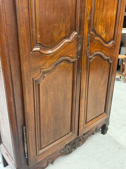 Rustic walnut cabinet opening with two doors.
19th...