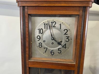 Wood and metal chime with eight hammers.
78...