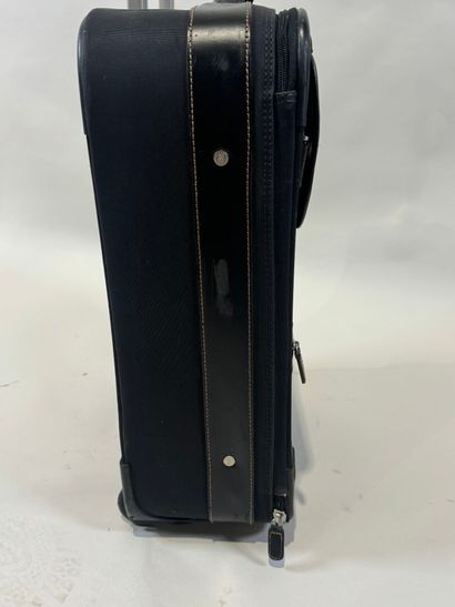 LANCEL. 
Travel suitcase or handbag on wheels...