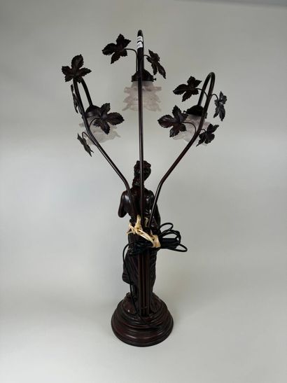 Three-armed resin lamp depicting a woman...