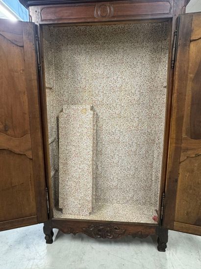 Rustic walnut cabinet opening with two doors.
19th...