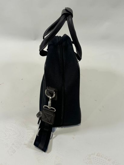LANCEL.
Black canvas and taupe leather travel...