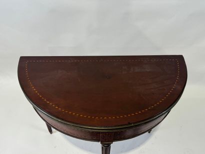 Mahogany and brass veneered half-moon console...