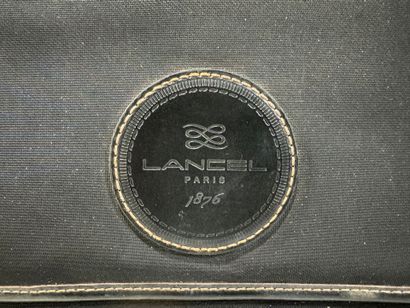 LANCEL. 
Travel suitcase or handbag on wheels...