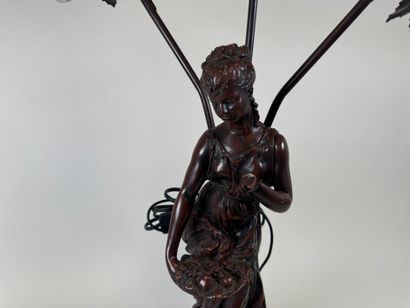 Three-armed resin lamp depicting a woman...