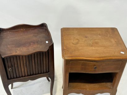 Two wooden bedside tables, one with curtain...
