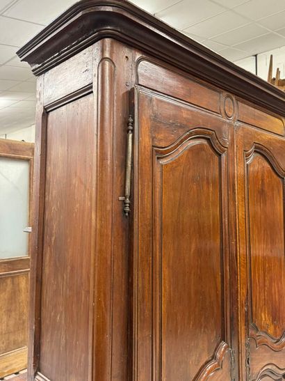 Rustic walnut cabinet opening with two doors.
19th...