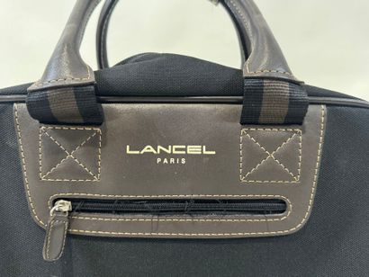LANCEL.
Black canvas and taupe leather travel...